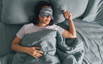8 Ways Tech Can Help You Sleep Better Tonight_woman sleeping with eye mask